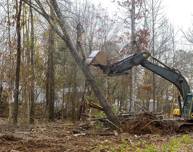 An Excavator being used to clear land